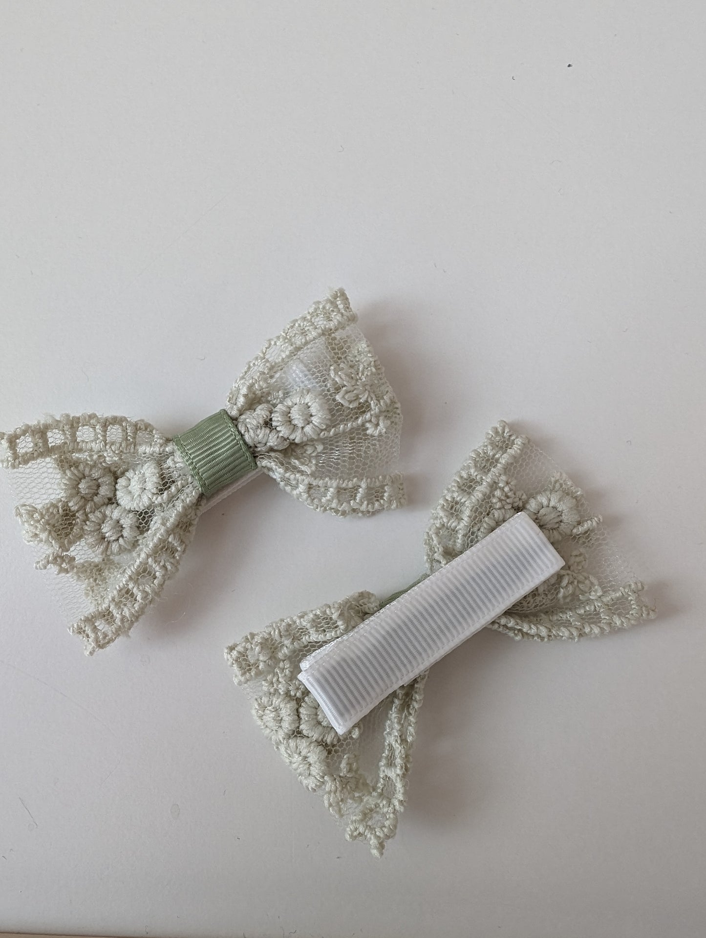 Elegant lace bow hair accessory in pistachio green for toddlers