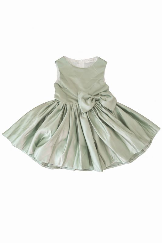 Green dress with a large bow on a white background